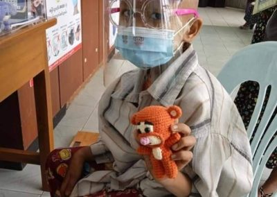 Sharing Our Strength - A Kid with a Crochet Toy